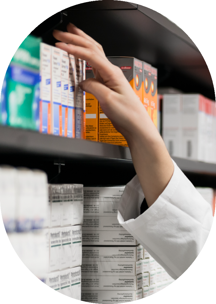 hand reaching for medicine on shelf